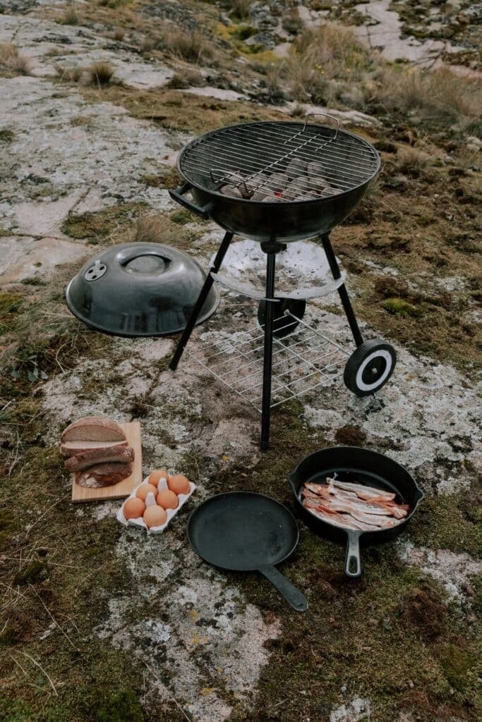 Bacon and Bread Lying next to a Grill Bacon and Bread Lying next to a Grill
