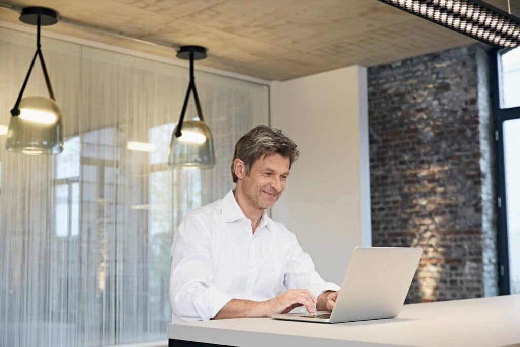 Businessman using laptop in office Businessman using laptop in office