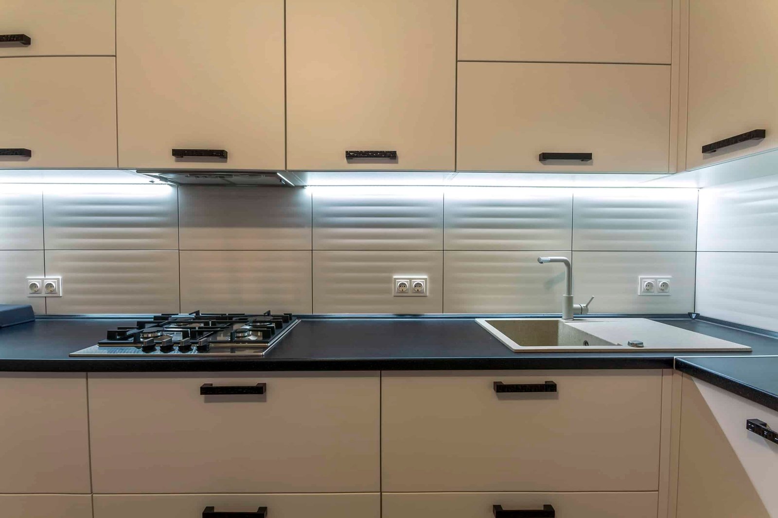 Contemporary wooden kitchen with faucet and under cabinet lights Contemporary wooden kitchen with faucet and under cabinet lights
