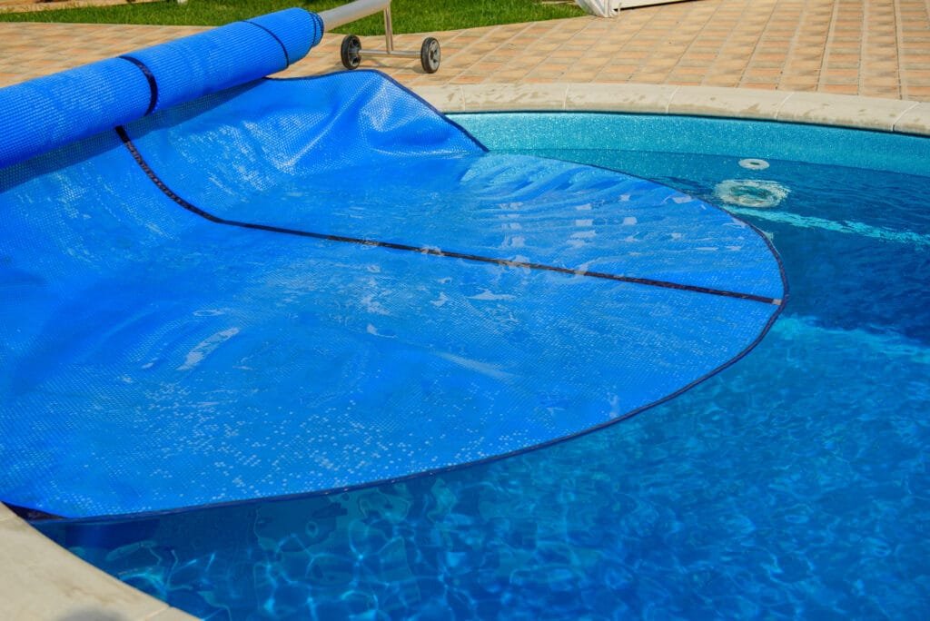 Blue tarpaulin pool cover