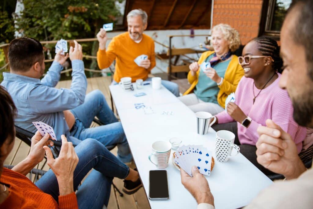 People Playing Cards Outside Patio People Playing Cards Outside Patio
