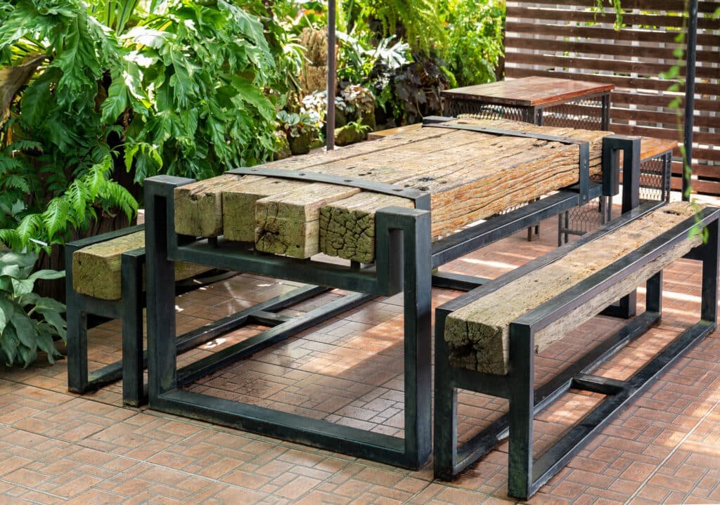 Solid thick rustic lumber table and matching benches with black
