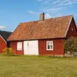 Rustic red exterior wooden house in vintage Scandinavian style 1200x800 1