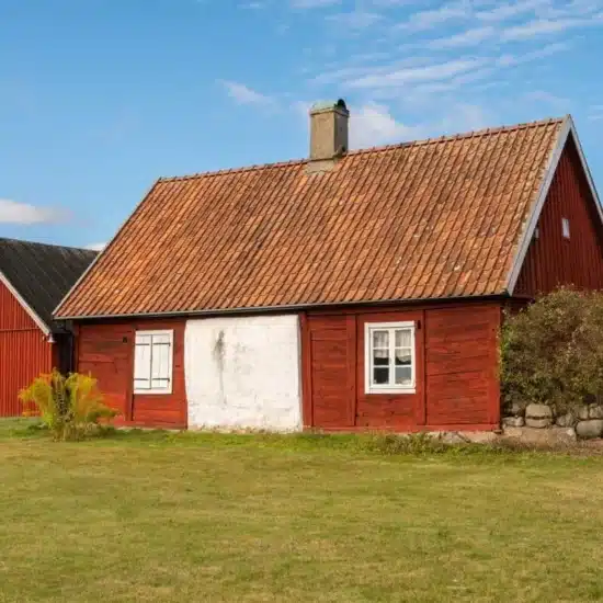 Rustic red exterior wooden house in vintage Scandinavian style 1200x800 1