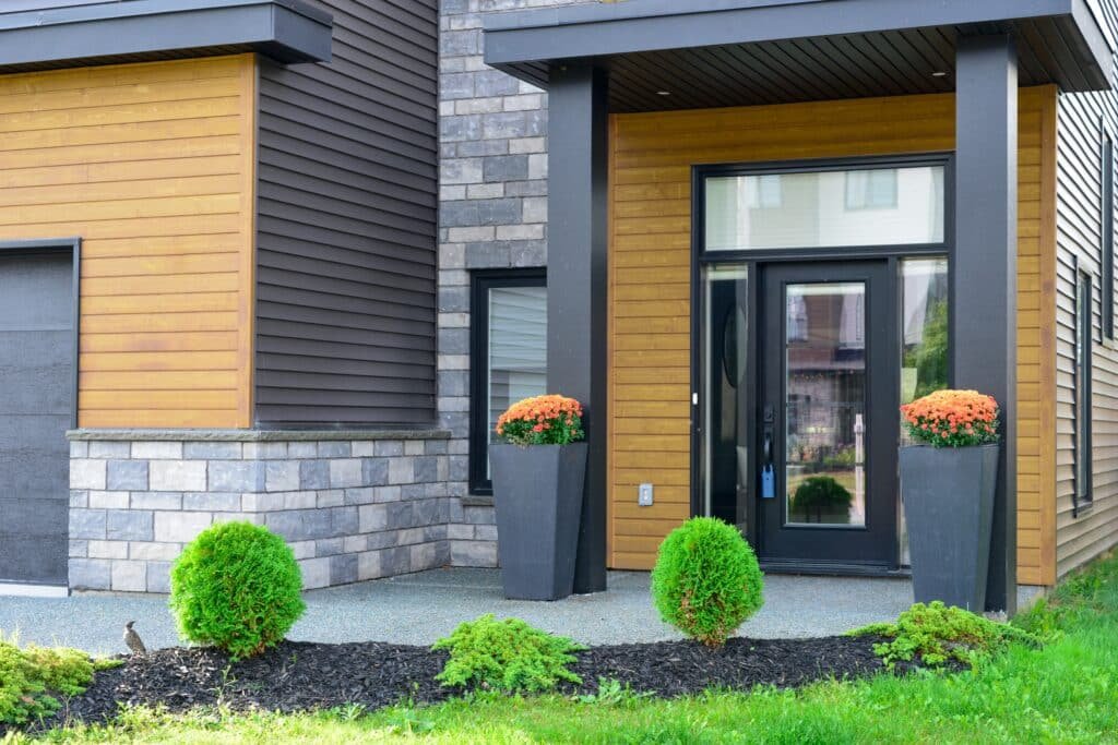 The ranch style exterior siding ideas with brown wood siding and grey brick The ranch style exterior siding ideas with brown wood siding and grey brick