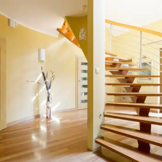 Spiral wooden staircase and doors in modern spacious interior 1200x800 1