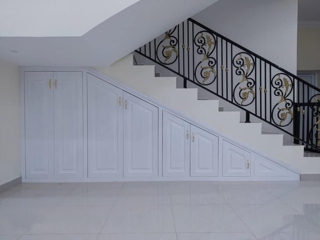Cupboard made under the stylish stairs Cupboard made under the stylish stairs