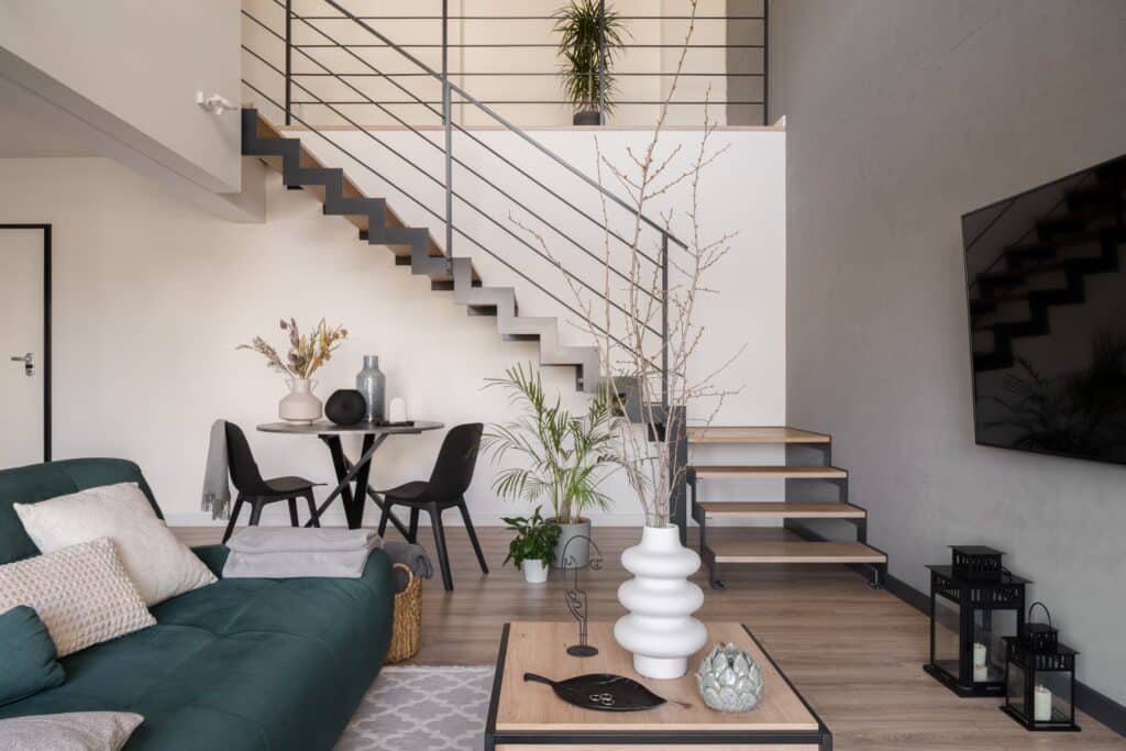 Living room with dining table under staircase Living room with dining table under staircase