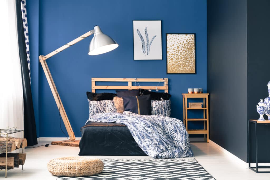 Navy and dark blue master bedroom with rug