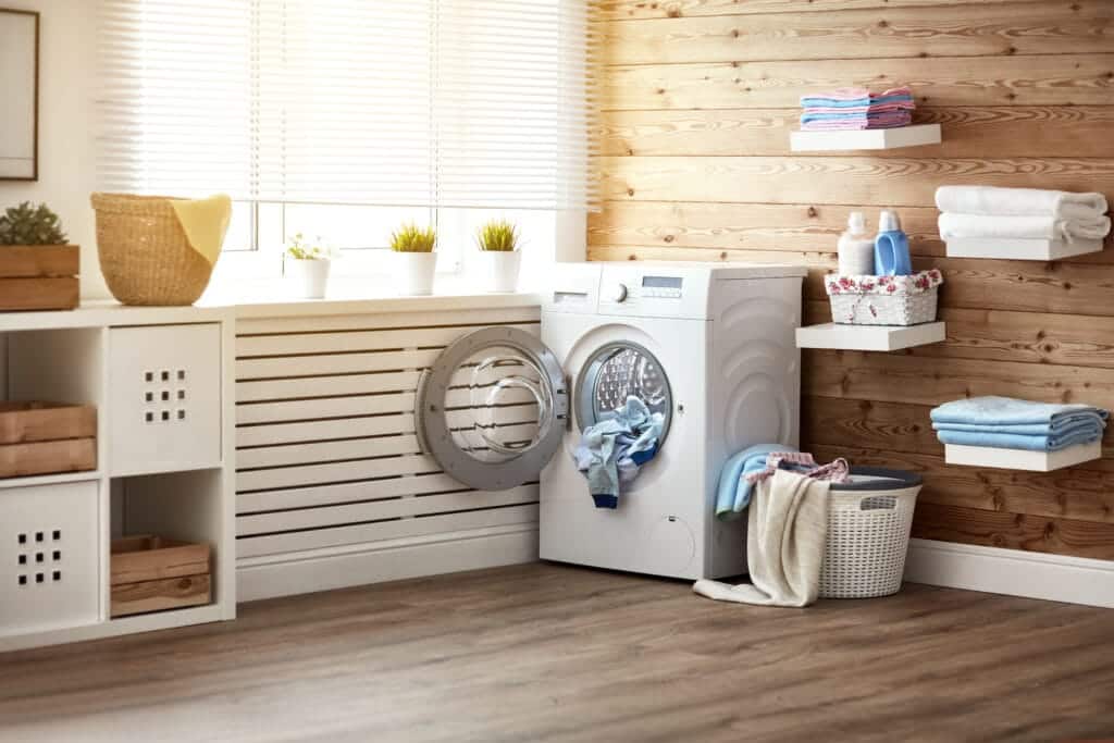 Laundry room with washing machine on the vunyl flooring