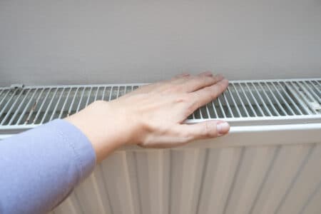 White heating baseboard of a central heating system