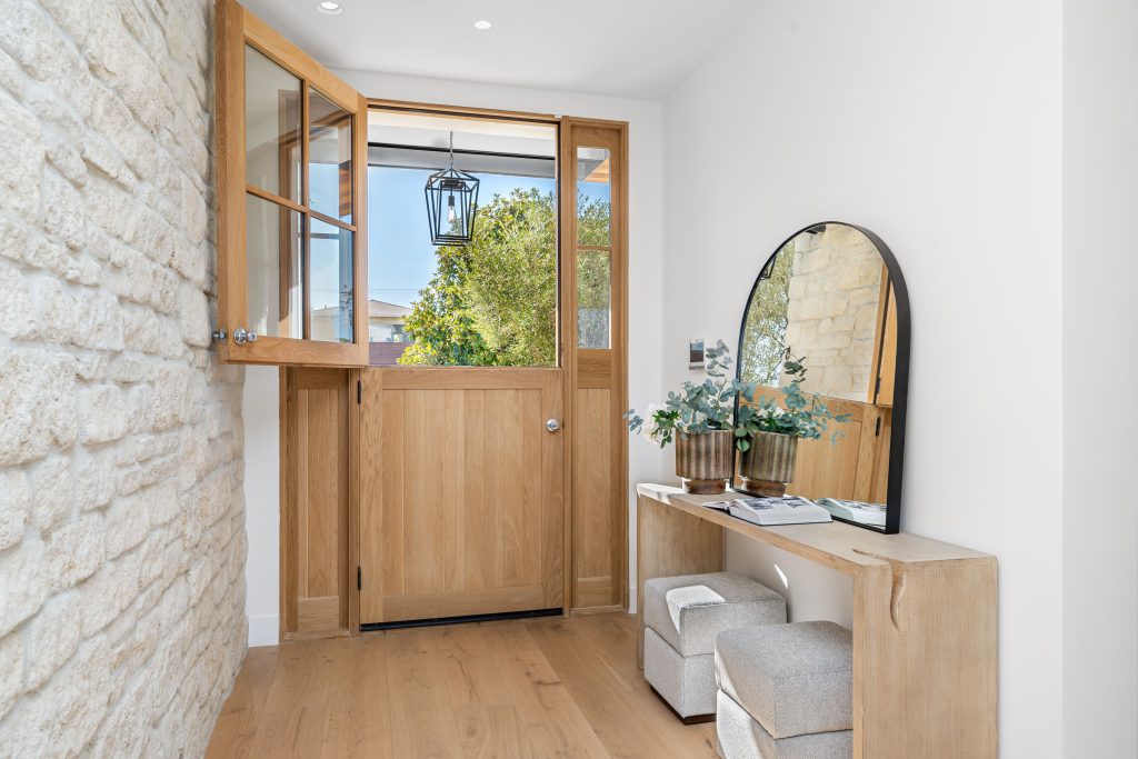 Modern entryway with wooden door and decor