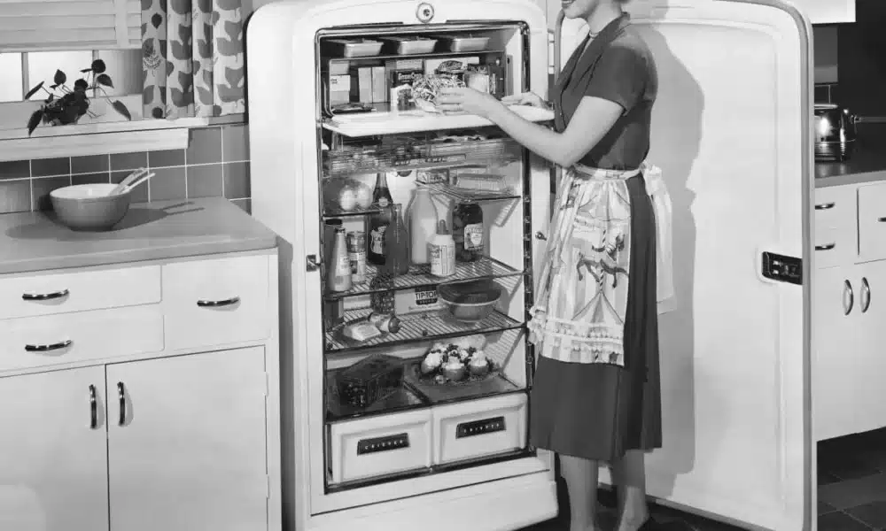 Woman with open refrigerator