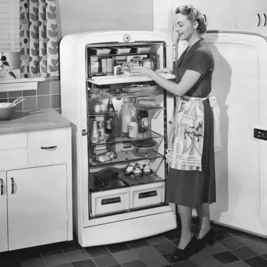 Woman with open refrigerator