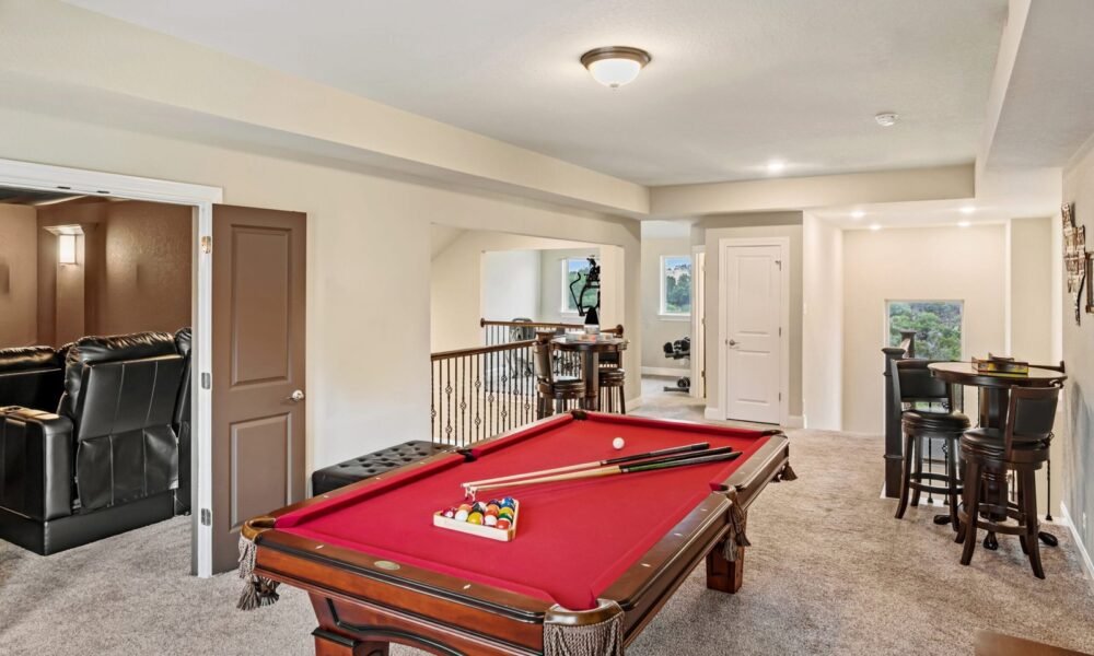 A home game room with a pool table scaled 1