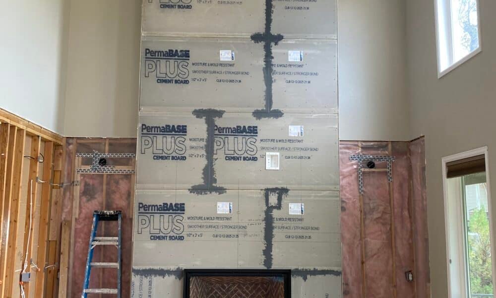 ● Zero clearance wood burning fireplace framed into a new construction living room wall