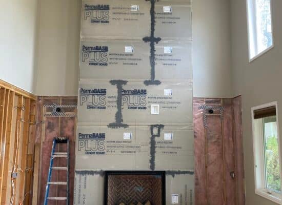 ● Zero clearance wood burning fireplace framed into a new construction living room wall